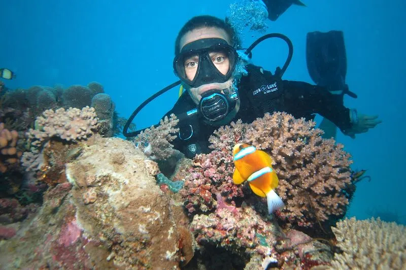 woman diving under water