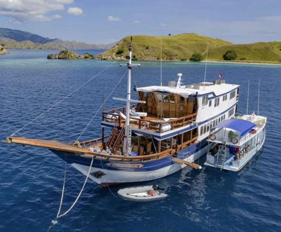 Sailing boat near Komodo Island at sunset