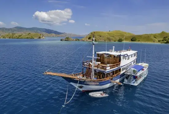 A group of boats floating on top of a body of water