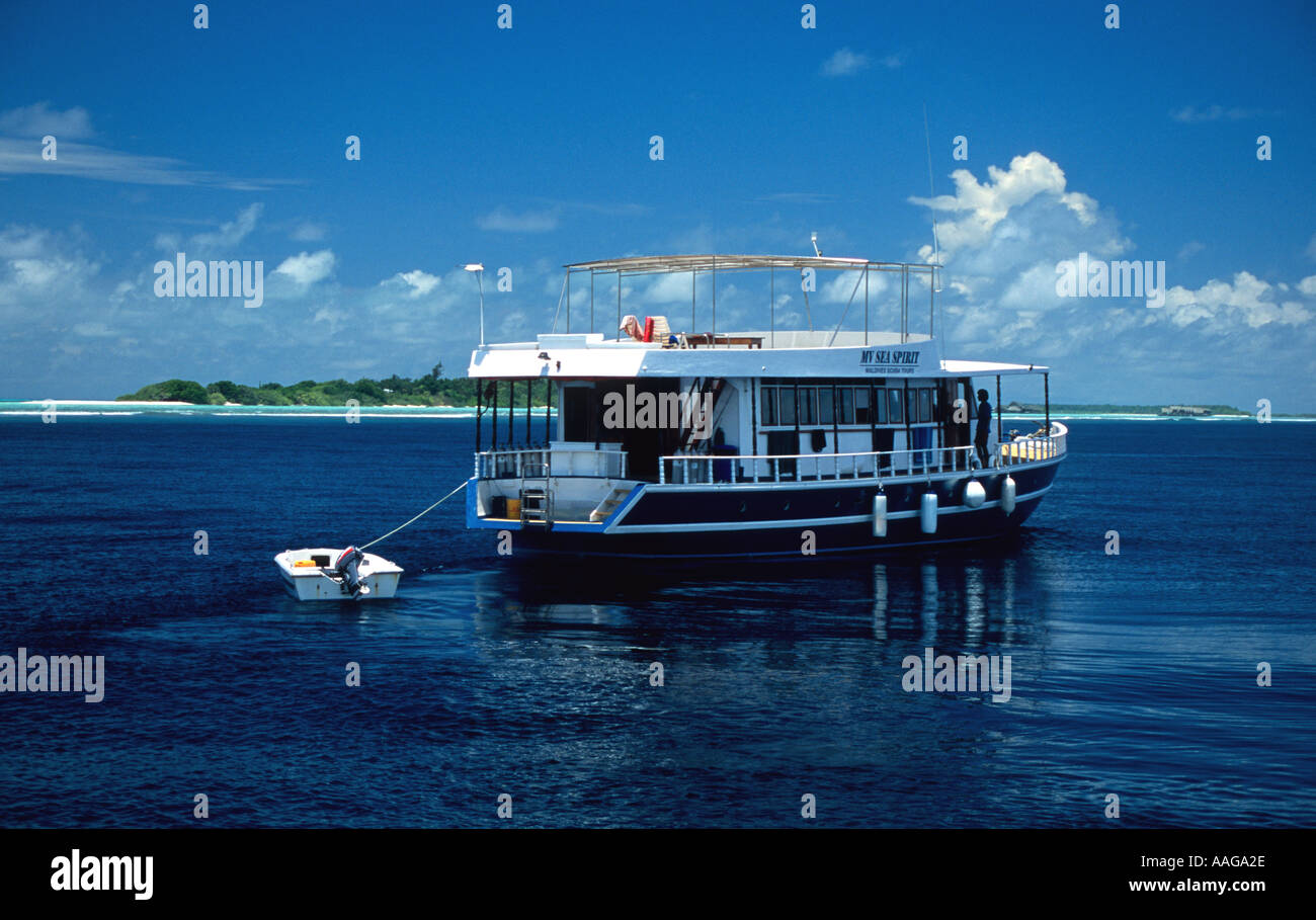 a small boat in the middle of a body of water